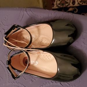 Black patent leather shoes with ankle closure